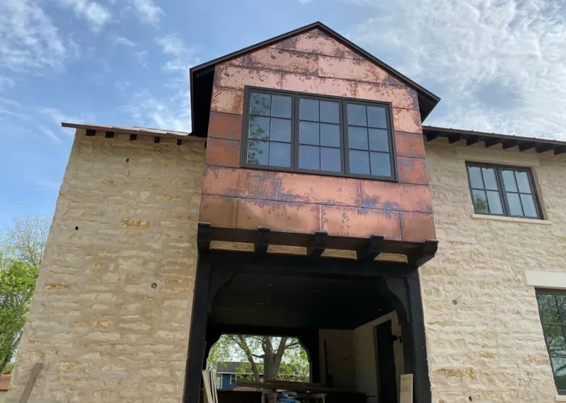 Copper metal panel facade on a stone building for Skylight Installation in Wauconda